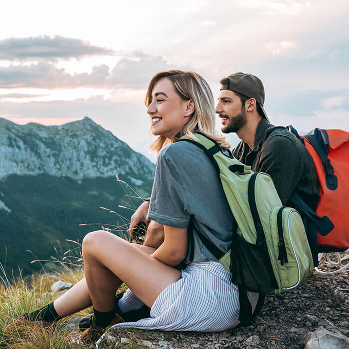 man and woman hiking on mountain together