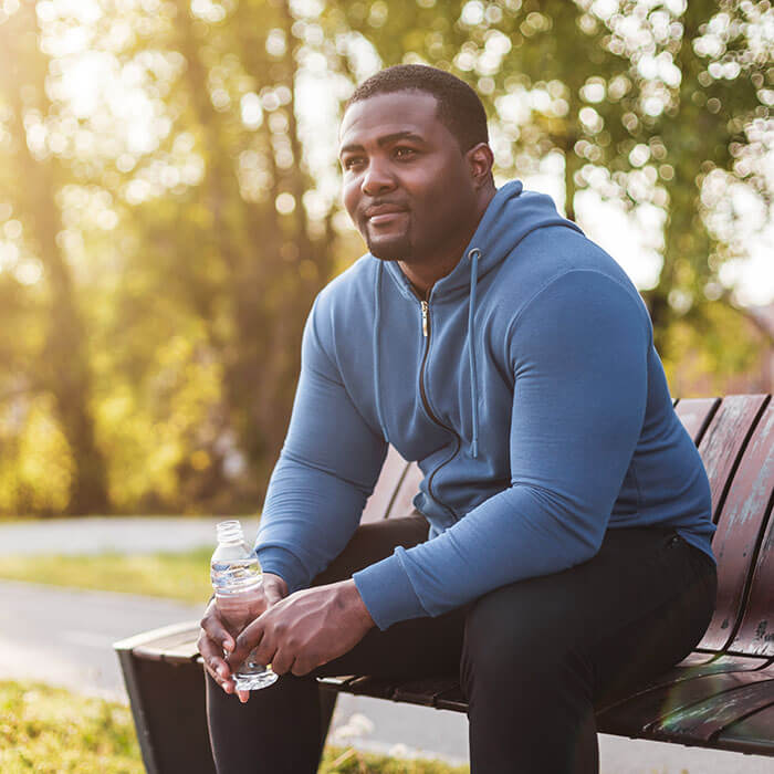 man sitting on bench in the park