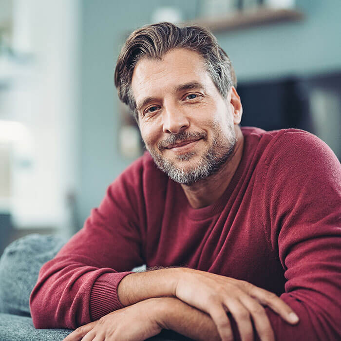 mature man smiling at home