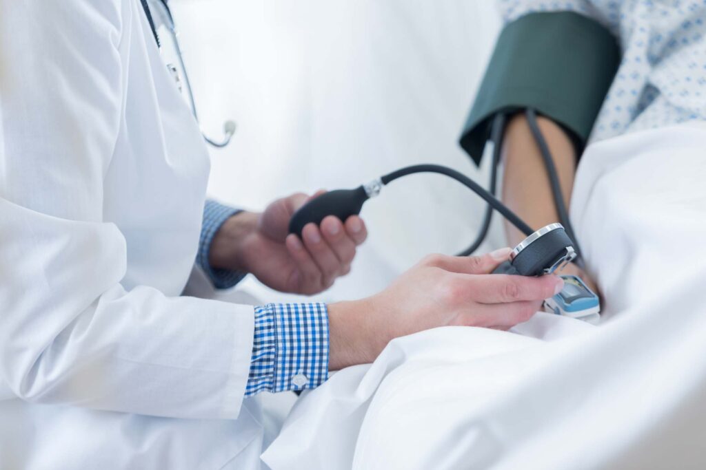 Blood pressure test using arm cuff to monitor hypertension while lying down